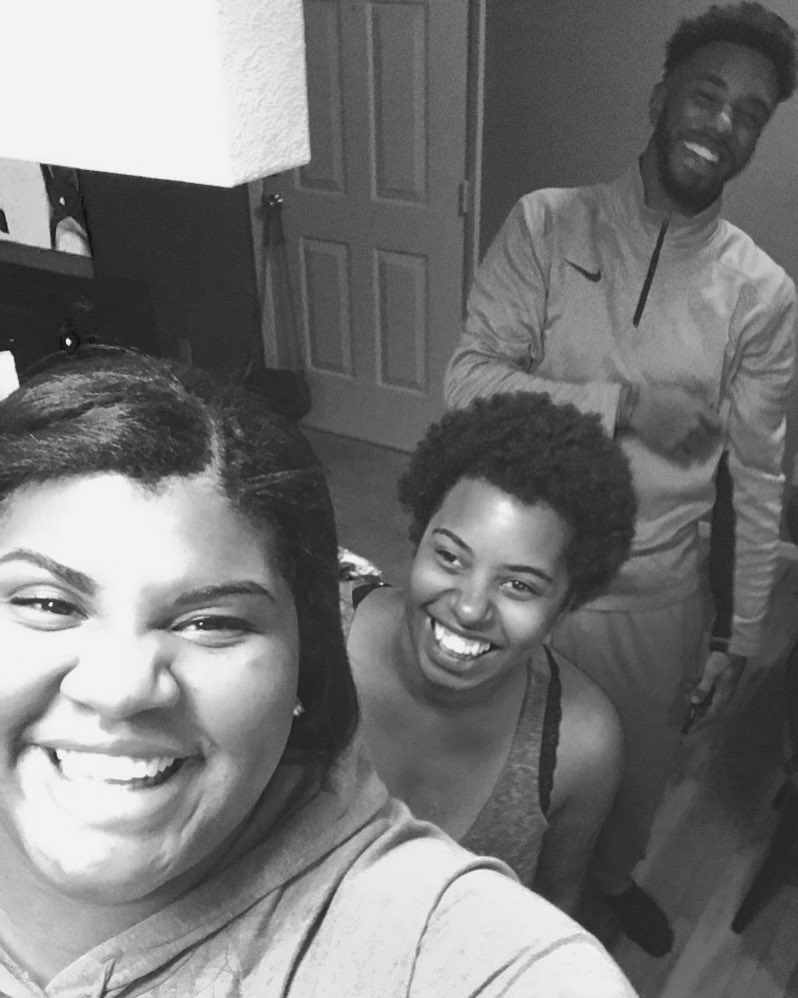 Black and white photo of Robin, Kayla and Kevin laughing together.